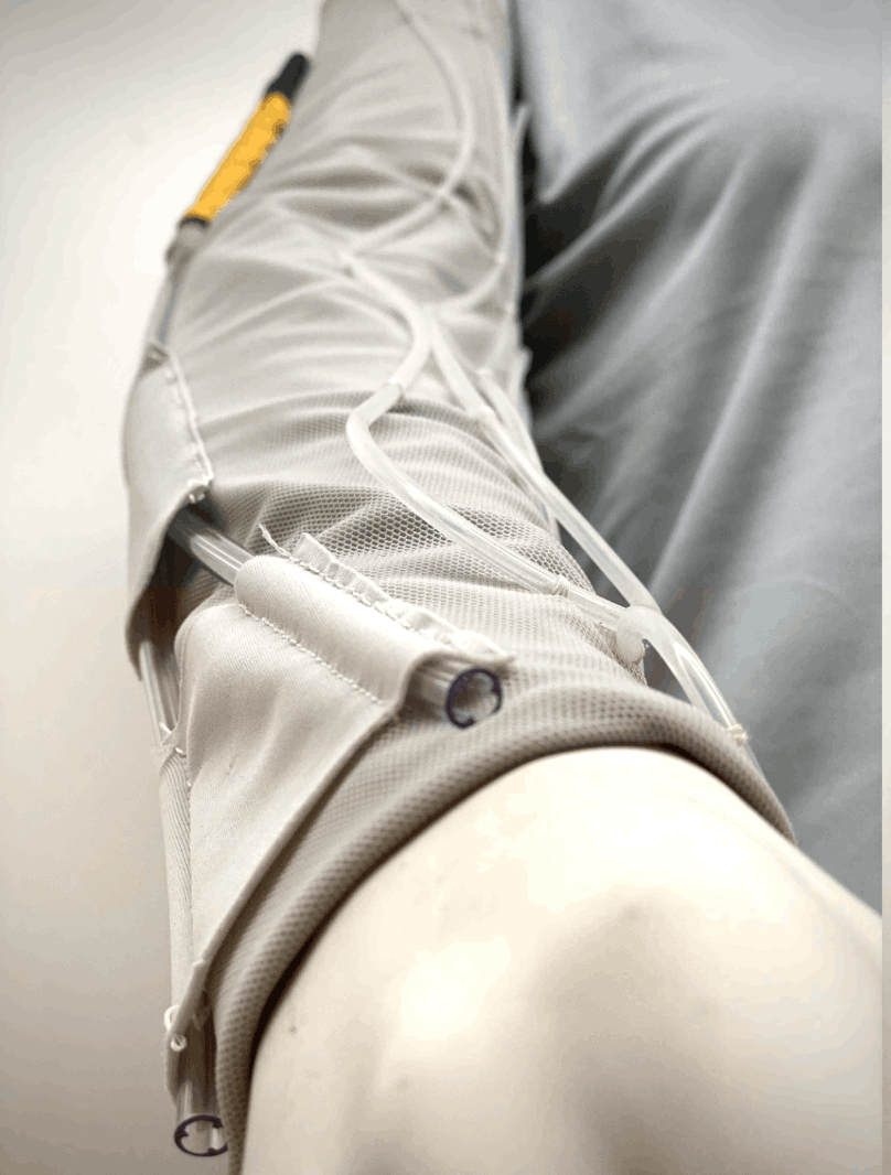 Close-up of the final sleeve and connector on the garment shoulder