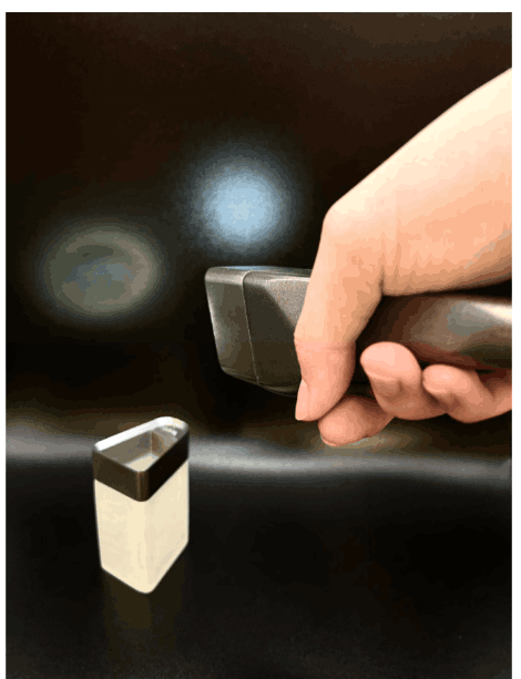 Flashlight lifted away from the base, ready to carry through a dark room