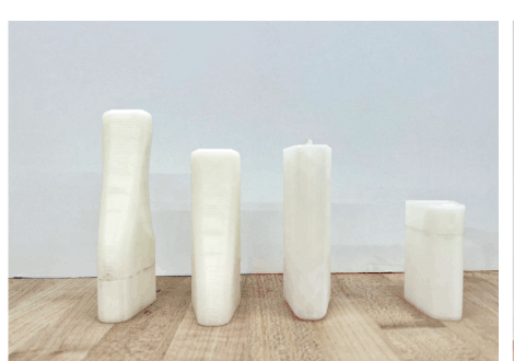 Four 3D-printed ergonomic study forms lined up for user testing