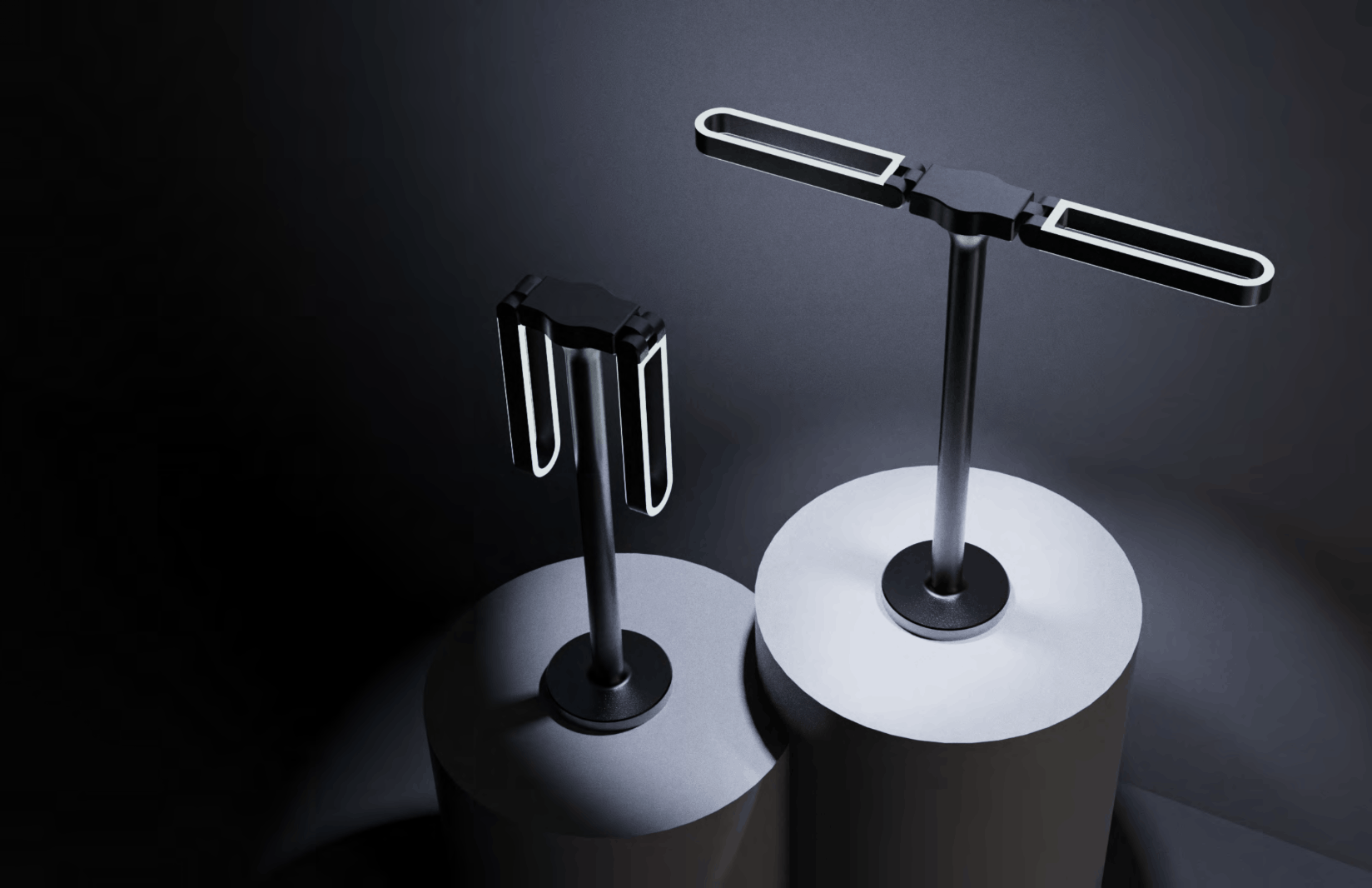 Lighting concept: two dark table lamps with illuminated loop-shaped heads on pedestals